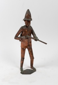 Copper sculpture of an Australian trooper with shotgun, signed "H. T., '73", 44cm high