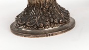 An antique sterling silver sugar caster, together with an antique sterling silver bonbon dish with repousse decoration, (2 items), ​​​​​​​the caster 22cm high, 5.7 grams total. - 2