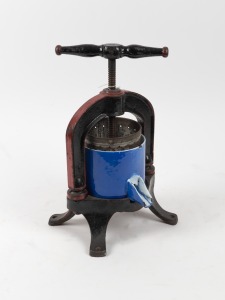 An antique French cast iron and enamel press, 19th century, ​​​​​​​39cm high