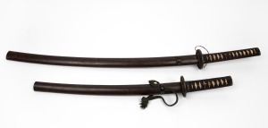 An antique pair of Japanese samurai swords comprising of a kutana and a wakusashi&nbsp;both with matching tsuba and scabbards, Edo period,&nbsp; 93cm and 65cm long. ​​​​​​​LICENCE REQUIRED.