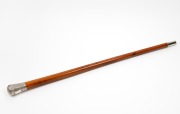 An antique walking stick with engraved silver top, full malacca shaft and silver finished ferrule, 19th century, 92cm high