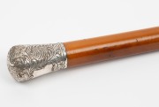 An antique walking stick with engraved silver top, full malacca shaft and silver finished ferrule, 19th century, 92cm high - 2
