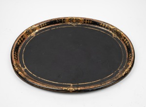 An antique oval papier-mâché serving tray with ornate gilt decoration, 19th century, 62cm wide
