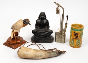 A Chinese opium pipe, a Chinese porcelain brush pot, an Egyptian carved basalt seated figure, a horn powder flask and a horn and timber bird ornament, mixed vintages, (5 items), the largest 25cm high
