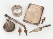 Antique sterling silver calling card case, bookmark, silver retractable pencil, napkin ring, pocket watch and three antique pocket watch keys, 19th and 20th century, (8 items), the calling card case 9cm high