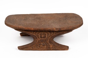 A tribal stool carved wood, Papua New Guinea origin, circa 1965, 20cm high, 58cm wide