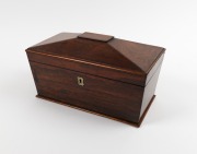 An antique English sarcophagus&nbsp;shaped rosewood tea caddy, interior fitted with two lidded compartments, early 19th century, 17cm high, 31cm wide, 17cm deep