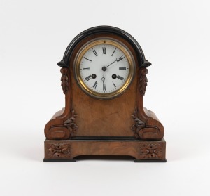 An antique French walnut cased mantle clock with ebonised trim and eight day time and bell striking movement, 19th century, 25cm high