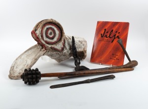 TRIBAL ARTEFACTS: Including Papua New Guinea pineapple head club, lime spatula, ceremonial headdress, African carved wooden spoon, an African axe and a publication titled "Jilji Life In The Great Sandy Desert" by Pat Lowe and Jimmy Pike, (6 items), the cl