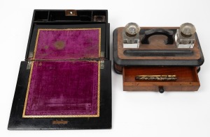 A Victorian walnut desk set with ebonised finish and two ink bottles; together with a lady's travelling writing box in papier-m&acirc;ch&eacute; with hand-painted finish and two vintage pens,&nbsp; the desk set 28cm wide