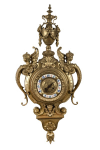 Antique French cartel clock in cast brass case with applied enamel Arabic numerals, time and strike movement, 19th century, 81cm high overall.
