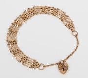 A vintage 9ct gold gate-link bracelet with heart lock, 20th century, ​​​​​​​7.7 grams.