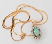 A vintage 9ct gold pendant with solid opal surrounded by seed pearls, suspended on a 14ct fine gold chain, 20th century, the pendant 2.3cm high, the chain 42cm long, 6.1 grams total. - 2