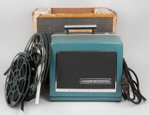 Bell and Howell&nbsp;542 optical sound16mm film projector in original box, with six film reel, five of which contain home movies.&nbsp;