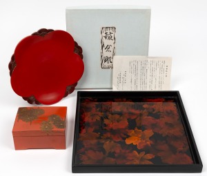A vintage Japanese orange lacquered bowl with chrysanthemum decoration; together with a red lacquered dish, (2 items), the dish 24cm wide