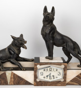 A French Art Deco three piece clock set with black slate and onyx case, adorned with spelter dogs and urn garnitures, circa 1930, 53cm high, 69cm wide - 2