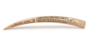 A scrimshaw walrus tusk cribbage board, North American origin, 20th century, 48cm long
