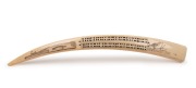 A scrimshaw walrus tusk cribbage board, North American origin, 20th century, ​​​​​​​48cm long