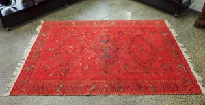A North Indian hand-woven red silk and cotton rug, ​​​​​​​200 x 138cm