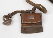 An antique Mongolian knife in scabbard with attached leather belt and tinder, 19th century, 37cm long overall - 2