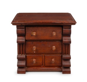 An unusual red pine miniature chest of four drawers with serpentine front, pearl inlaid handles and shaped corbels, Barossa Valley, South Australian origin, 19th century, 42cm high, 46cm wide, 31cm deep.