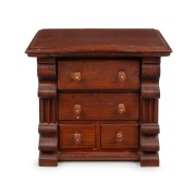 An unusual red pine miniature chest of four drawers with serpentine front, pearl inlaid handles and shaped corbels, Barossa Valley, South Australian origin, 19th century, 42cm high, 46cm wide, 31cm deep.