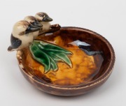 GRACE SECCOMBE pottery dish with applied gum leaves and a graduated family of three kookaburras, incised "Grace Seccombe", 7cm high, 12.5cm wide - 2