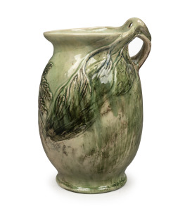 MERRIC BOYD green glazed pottery vase with wind swept tree branch handle and applied tree fern decoration, incised "Merric Boyd, 1936", an impressive 32cm high