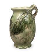MERRIC BOYD green glazed pottery vase with wind swept tree branch handle and applied tree fern decoration, incised "Merric Boyd, 1936", an impressive 32cm high