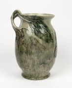 MERRIC BOYD green glazed pottery vase with wind swept tree branch handle and applied tree fern decoration, incised "Merric Boyd, 1936", an impressive 32cm high - 3