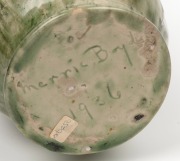 MERRIC BOYD green glazed pottery vase with wind swept tree branch handle and applied tree fern decoration, incised "Merric Boyd, 1936", an impressive 32cm high - 5