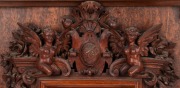 ROBERT PRENZEL&nbsp;(1866-1941), mirror frame, sumptuously carved with grotesques, angels, grapes and foliate motifs, crested by a&nbsp;shield dated 1889. A rare and early example, signed lower right "ROBERT PRENZEL", 51 x 41cm&nbsp; overall. See full page illustration, - 2