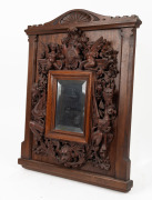 ROBERT PRENZEL&nbsp;(1866-1941), mirror frame, sumptuously carved with grotesques, angels, grapes and foliate motifs, crested by a&nbsp;shield dated 1889. A rare and early example, signed lower right "ROBERT PRENZEL", 51 x 41cm&nbsp; overall. See full page illustration, - 7