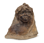 WILLIAM RICKETTS pottery bust of an Aboriginal boy, mounted on granite stone, 35cm high, 35cm wide, 27cm deep