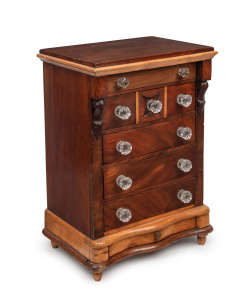 A Colonial Australian apprentice chest of drawers, cedar and pine with serpentine front, carved corbels and glass knobs, South Australian origin, 19th century, 51.5cm high, 36cm wide, 25cm deep