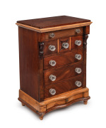 A Colonial Australian apprentice chest of drawers, cedar and pine with serpentine front, carved corbels and glass knobs, South Australian origin, 19th century, 51.5cm high, 36cm wide, 25cm deep
