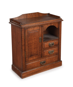 An antique Australian apprentice Beaconsfield miniature cabinet crafted in Queensland fiddleback maple with huon pine secondary timbers, late 19th century, 47cm high, 42cm wide, 20cm deep