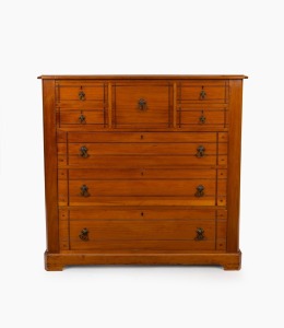 An antique Australian kauri pine chest of seven drawers with incised decoration and brass swing handles, Baltic pine secondary timbers, Melbourne origin, circa 1890, 113cm high, 119cm wide, 50cm deep