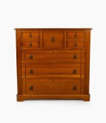 An antique Australian kauri pine chest of seven drawers with incised decoration and brass swing handles, Baltic pine secondary timbers, Melbourne origin, circa 1890, 113cm high, 119cm wide, 50cm deep
