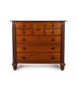 A rare and unusual antique Australian cedar chest of eight drawers with carved half barley twist columns, inverted breakfront with cross grained cushion moulded drawer blades and blackwood diamond escutcheons, Tasmanian origin, circa 1835, most likely the