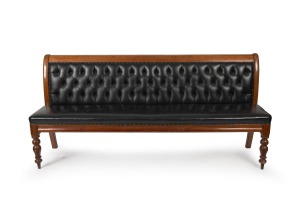 An antique Colonial Australian cedar settle upholstered in diamond button back black leather, Melbourne origin, 19th century, 98cm high, 208cm wide, 54cm deep