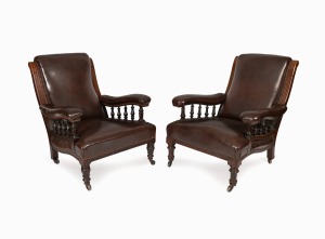 MELBOURNE CLUB a near pair of armchairs, mahogany and brown leatherette, late 19th century, 75cm across the arms