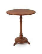 A Colonial Australian wine table, solid huon pine slab top with blackwood column and base, Tasmanian origin, 19th century, 75cm high, 60.5cm diameter