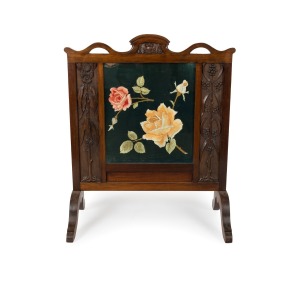 An Australian Arts & Crafts fire screen, carved blackwood with gumnuts, blossoms and wattle, circa 1900, 99cm high, 82cm wide, 41cm deep