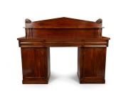 An antique Colonial Australian cedar twin pedestal sideboard with a Grecian Palladium back, turned supports, cross banded edge with pine string inlay, Tasmanian origin, circa 1845, 150cm high, 182cm wide, 56cm deep.