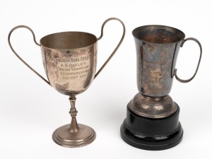 The Commonwealth Bank Athletic Club Mens Champion cup presented to A. S. Oakley (Ross Oakley's uncle) on September 23rd 1925, with matching wooden plinth, together with a presentation cup engraved 'St. Kevins OCCC, 1972-1973, 100 Wickets, R. Oakley'. (2 items)