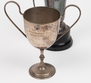 The Commonwealth Bank Athletic Club Mens Champion cup presented to A. S. Oakley (Ross Oakley's uncle) on September 23rd 1925, with matching wooden plinth, together with a presentation cup engraved 'St. Kevins OCCC, 1972-1973, 100 Wickets, R. Oakley'. (2 i - 2