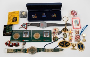 Remainder lot of twenty-nine branded sporting items, mostly international but with some Australian, including pins, watches, coins, etc. (29 items)