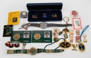 Remainder lot of twenty-nine branded sporting items, mostly international but with some Australian, including pins, watches, coins, etc. (29 items)