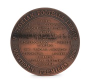 HAWTHORN 1986 PREMIERSHIP: Bronze&nbsp;premiership medal by Andor Meszaros (who also designed the 1956 Melbourne Olympics medals), with image of footballer to the obverse, and reverse showing the names of players in their positions, surrounded by text 'Victori - 2